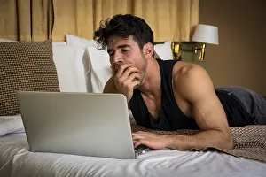 Young Man Working Prints: Attractive Young Man with Serious Expression