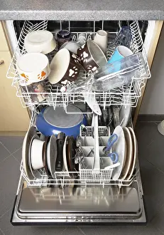No People In The Kitchen Prints: automatic dishwasher machine filled with clean dishes