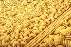 Empty Plate Cuisine Prints: Background of different types of raw pasta close up