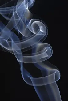 Empty Studio Environment Photo Prints: Backlit incense with black backdrop
