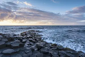 Irish Coastal Scenery Prints: Basalt columns by the coast at sunset