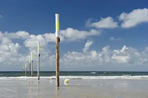 German Coastal Area Photo Prints: Beach and marker posts against the sky