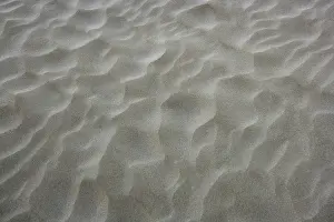 Uninhabited Shoreline View Prints: Beach sand waves warm texture pattern background