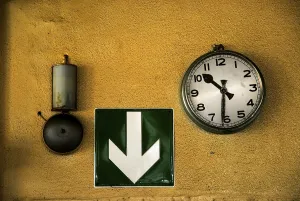 Abandoned Building Interior Prints: Bell, arrow directing to emergency exit and clock on the wall