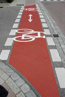 Road Surface Markings Prints: Bicycle path marked with red