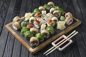 Sushi Rolls Prints: Big set of rolls served on stone plate