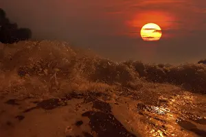 No People Beach Scene Prints: Big wave front with bubbles and splashes at sunset