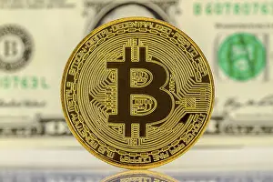 Cryptocurrency Capital Market Prints: Bitcoin with dollar bill in the background