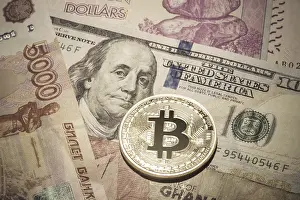 Cryptocurrency Capital Market Prints: One Bitcoin on multicurrency banknotes