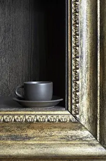 Tableware Arrangement Prints: Black cup on a shelf in the form of a frame