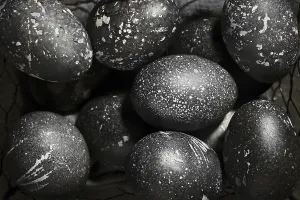 Christian Holiday Traditions Prints: Black painted eggs for Easter in a basket