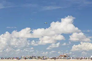 Stunt Kite Flying Prints: Blue sky with clouds over the beach