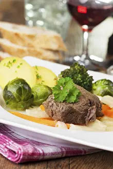 Uninhabited Kitchen Scene Prints: Boiled beef on a plate with vegetables