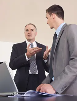 Office Work Clothes Prints: Boss and trainee working together on a computer