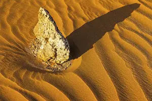 Western Asia Desert Landscapes Prints: Boulders surrounded by wind-blown sand structures