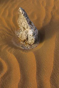 Desert Patterns And Designs Prints: Boulders surrounded by wind-blown sand structures