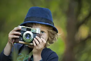 Daytime Portrait Photo Prints: Boy, 5, with an old camera