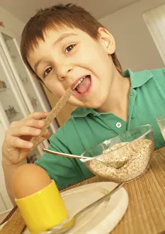 Healthy Breakfast For Kids Prints: Boy eats healthy breakfast with egg