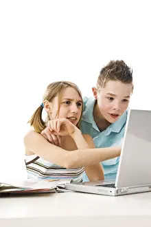 Computer Learning Prints: Boy and girl learning together with a computer