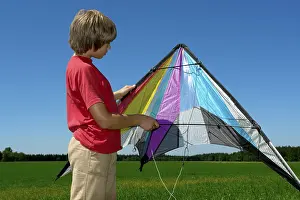 Stunt Kite Prints: Boy is going to launch his stunt kite