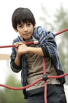 Child Playing Outdoors Prints: Boy on a playing ground