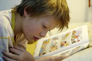 Cozy Bedtime Reading Prints: Boy reading in bed
