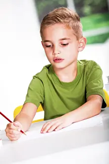 Education For Kids Prints: Boy with a sketch-pad at a table