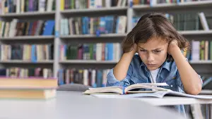 Educational System Prints: Boy thinking hard about how solve his homework with