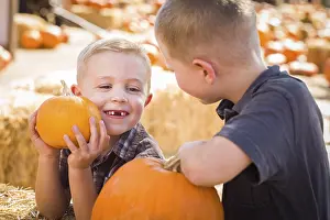 Pumpkin Patch Fun Prints: Two boys at the pumpkin patch talking about their pumpkins and having fun on a fall day