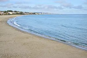 Spanish Beaches Prints: Breaking waves on a sandy beach