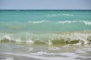 Southern Europe Waves Prints: Breaking waves on a sandy beach