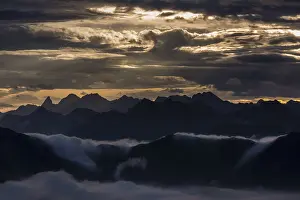 Backlit Mountain Peak Prints: Bregenzerwald mountains with clouds below