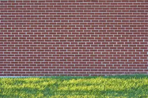 Travel Photography Canada Prints: A brick wall with a meadow in front of it
