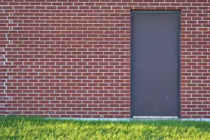 Ontario Canada Landscape Photography Prints: Brick wall with rectangular door and a meadow in front of it