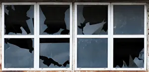 Deserted Exterior View Prints: Broken windows of old building. White frames