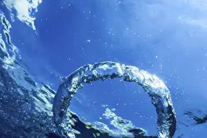 Deserted Ocean Scene Prints: Bubble Ring Ascends towards the Sun, Underwater