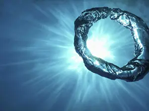 Deserted Underwater World Prints: Bubble Ring Underwater ascends towards the Sun