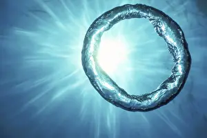 Deserted Underwater World Prints: Bubble Ring Underwater ascends towards the Sun