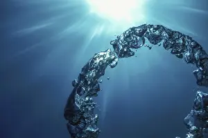 Deserted Underwater World Prints: Bubble Ring Underwater ascends towards the Sun