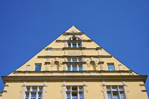 Clear Sky Photography Prints: Building with striking triangular gable and windows against a clear sky
