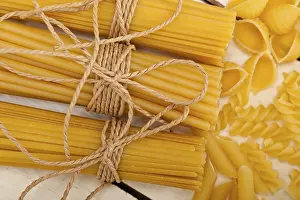 Abstract Pasta Art Prints: Bunch of Italian pasta type on a white rustic table