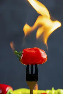 Red Chili Peppers Prints: Burning red pepperoni on a fork