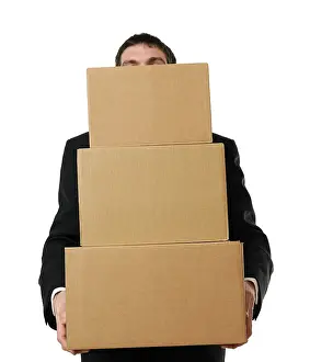 Caucasian Male In Studio Shot Prints: Businessman overloaded with a stack of boxes
