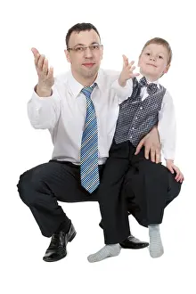 Young Entrepreneur Prints: Businessman and his son pulled his hands in the studio