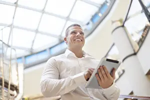 Single Person In Business Wear Prints: Businessman with tablet computer in hands