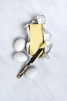 Butter Packaging Prints: Butter in opened packaging and eggs