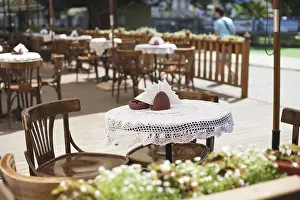 Deserted Coffee Shop Scene Prints: Cafe with rustic tableware and chairs outdoors