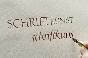 Calligrapher In Upper Bavaria Prints: Calligraphy studio, hand writes text with ink