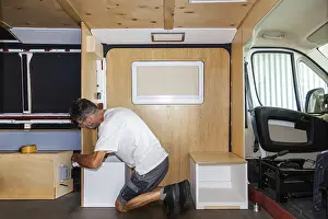 Images Dated 9th September 2024: Camper Van Conversion Print: Installing Chairs and Seat Box