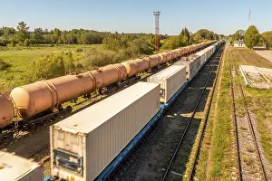 Cargo Transport Vessel Prints: Cargo train platform with white freight containers on the train
